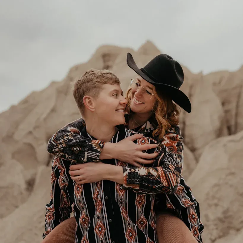 Western style LGBTQ+ couple at a rock quarry near St. Joseph, MO